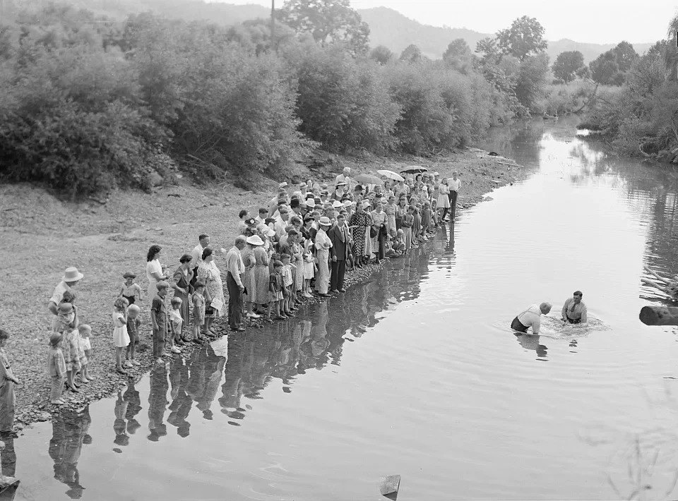Members of the Primitive Baptist Church in Morehead, Kentucky, attending a creek baptizing by submersion, 1940. Farm Security Administration photograph by Marion Post Wolcott.